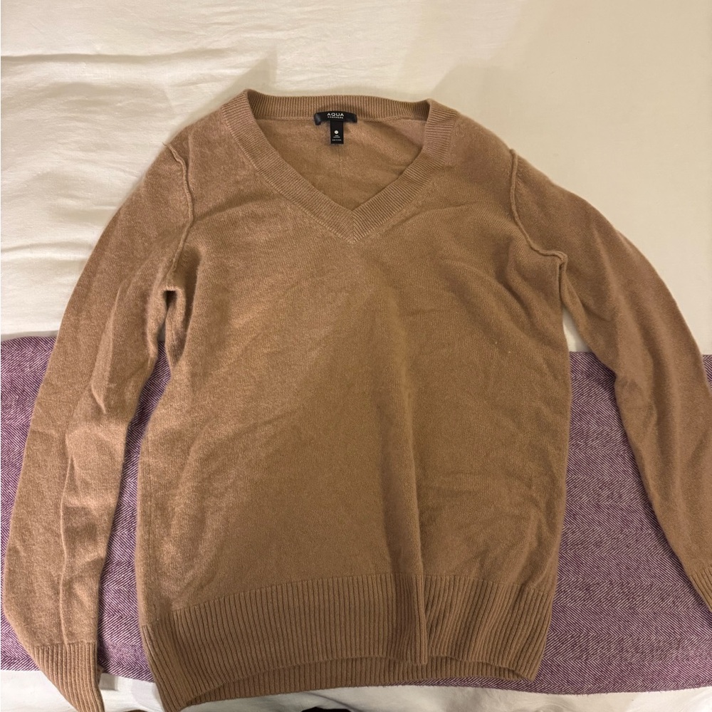 V neck cashmere sweater in tan/camel. Brand is aqua. Condition is excellent.